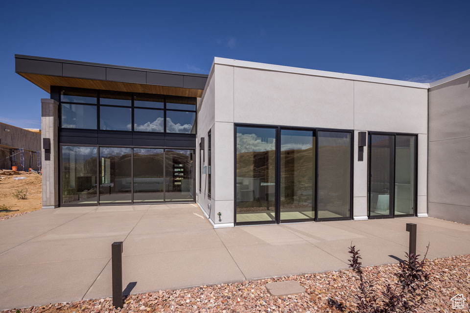 Rear view of house featuring a patio