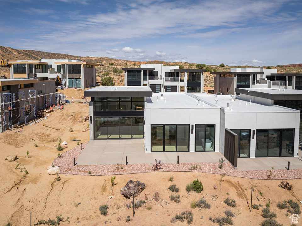 Rear view of house featuring a mountain view