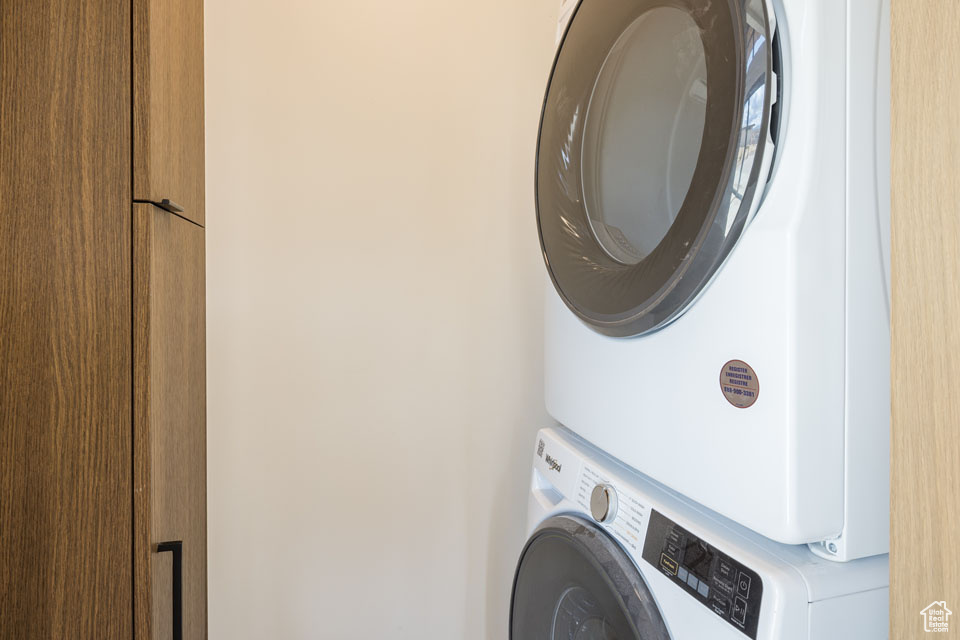Laundry area with estacked washer and dryer