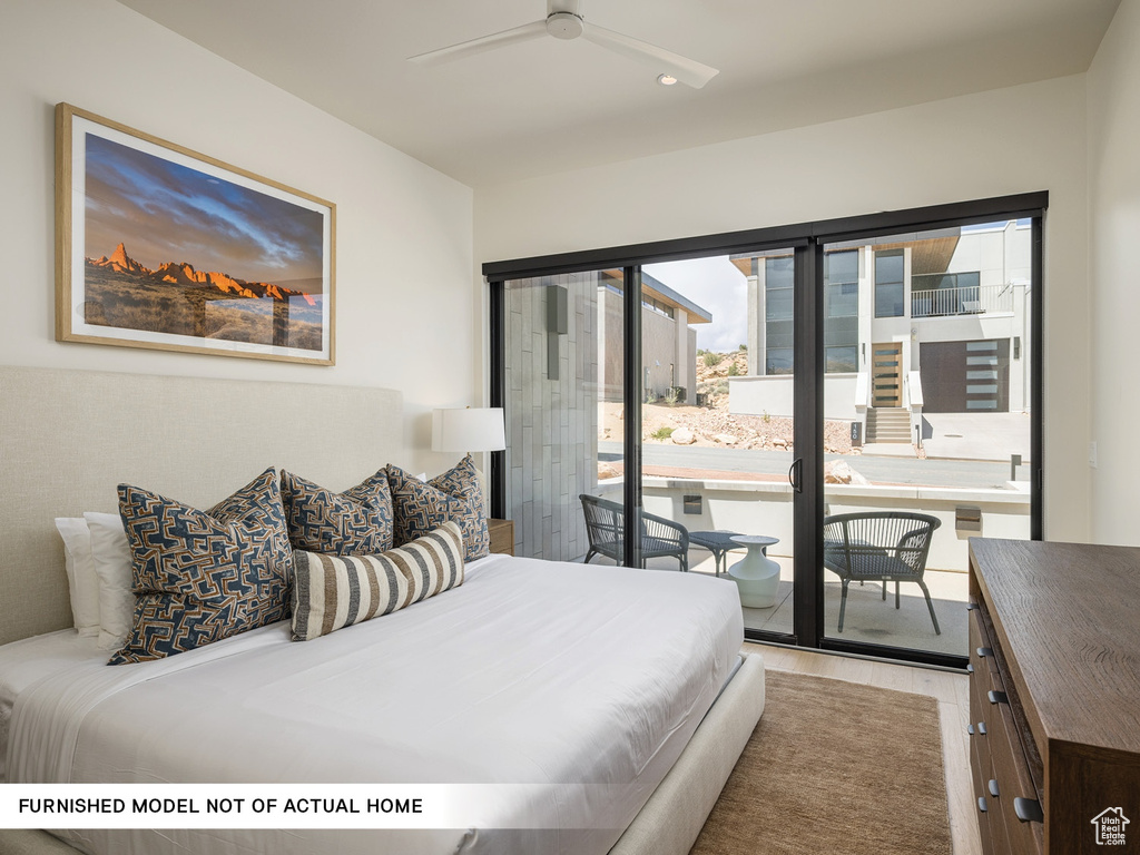 Bedroom featuring access to outside, wood finished floors, recessed lighting, and ceiling fan