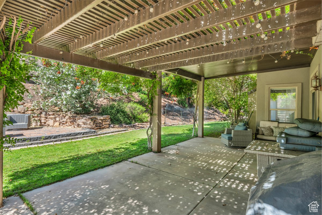 View of patio with a pergola and outdoor lounge area