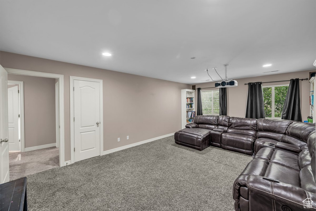 Living room featuring carpet and recessed lighting