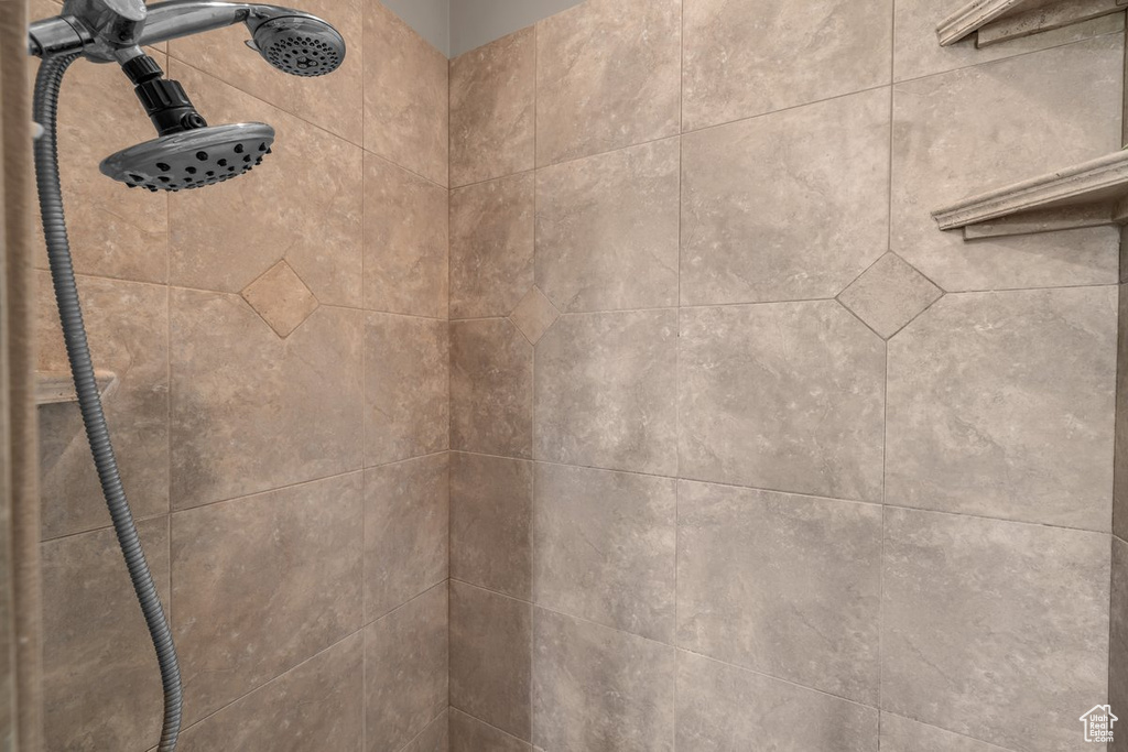 Bathroom view of a tile shower
