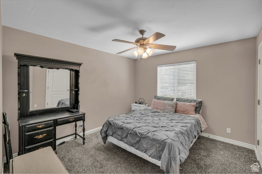 Bedroom with carpet flooring and ceiling fan