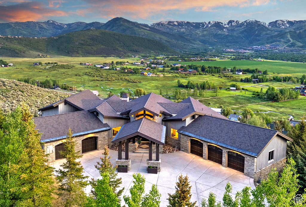View of subject property with mountains