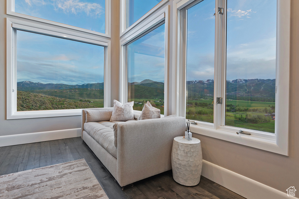 Sunroom / solarium with plenty of natural light and a mountain view