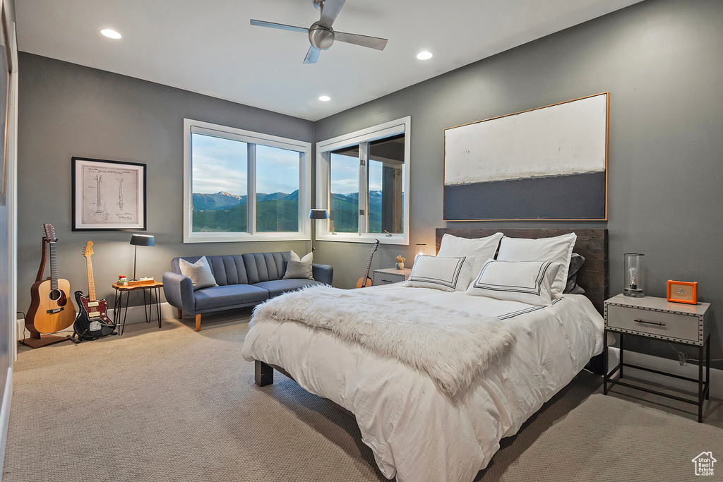 Carpeted bedroom featuring recessed lighting and ceiling fan