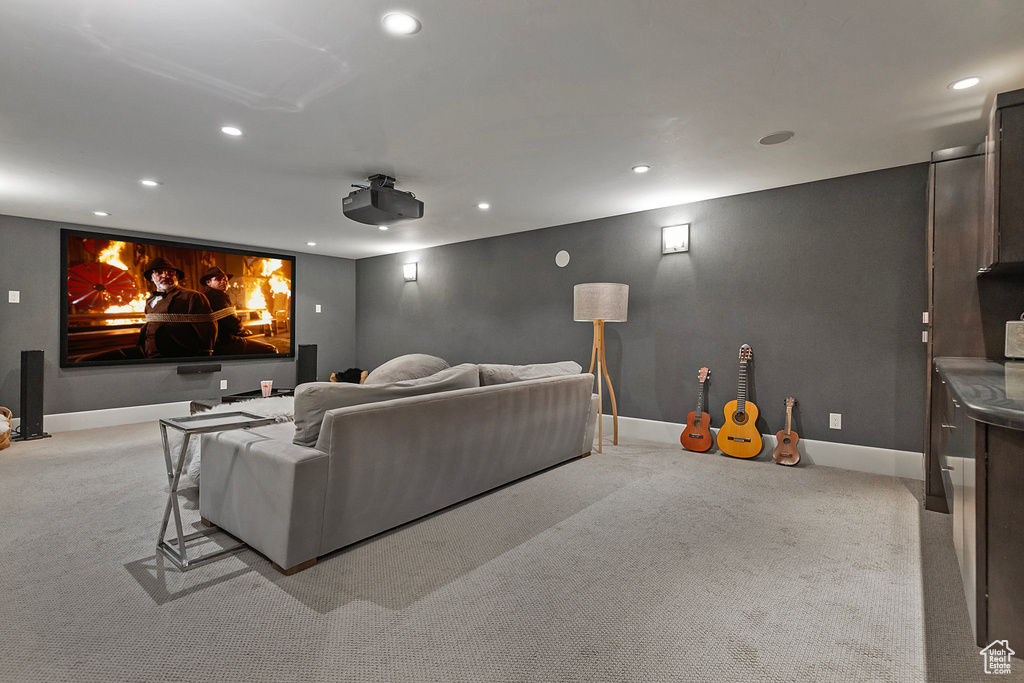 Cinema with recessed lighting, light colored carpet, and baseboards