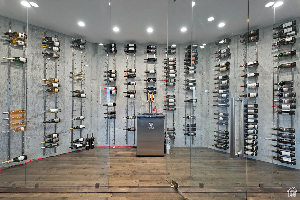 Wine area featuring hardwood / wood-style flooring and recessed lighting