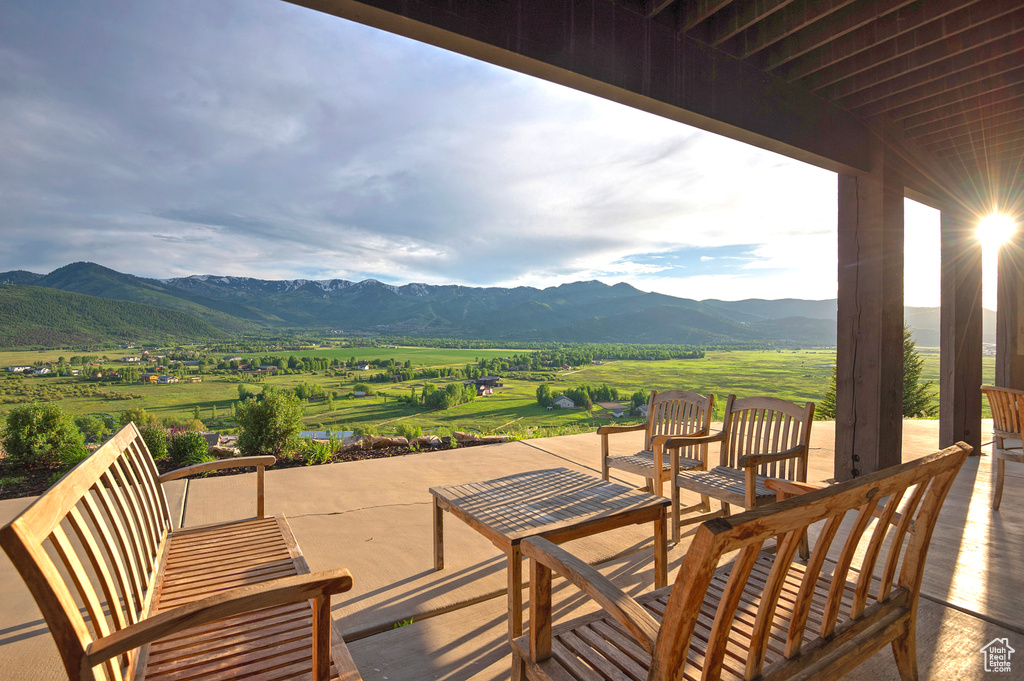 View of patio with a mountain view and a rural view
