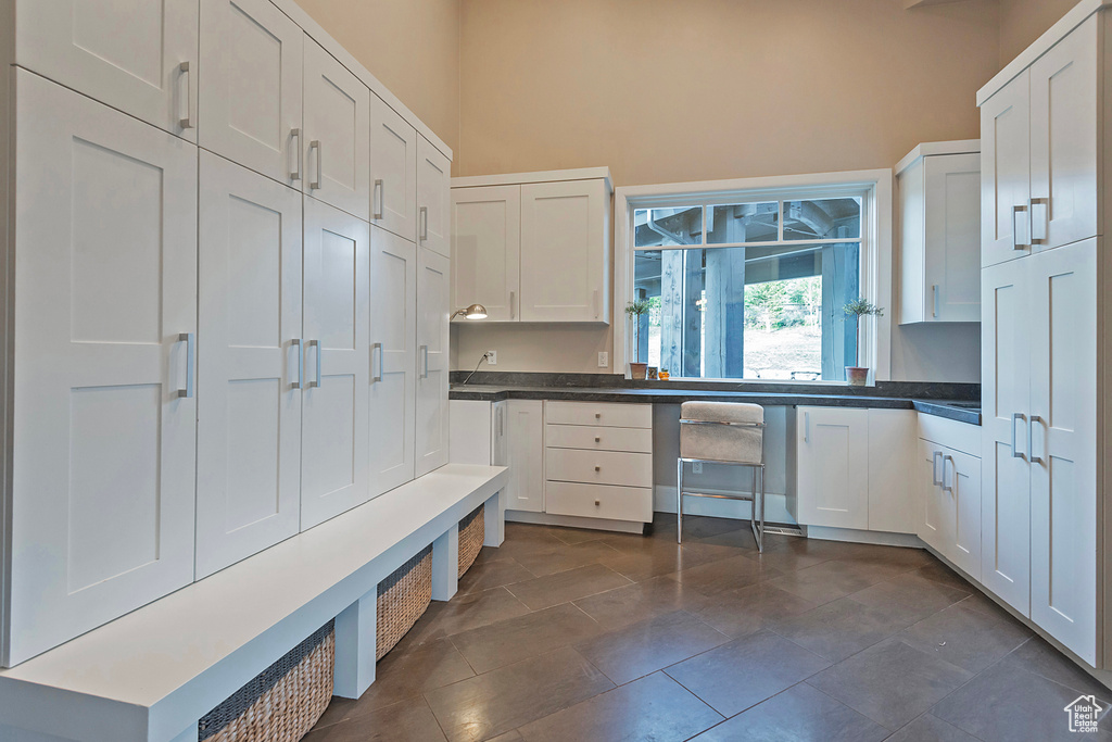 Mudroom featuring dark tile patterned flooring