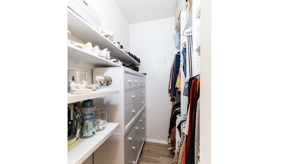 Walk in closet featuring wood finished floors