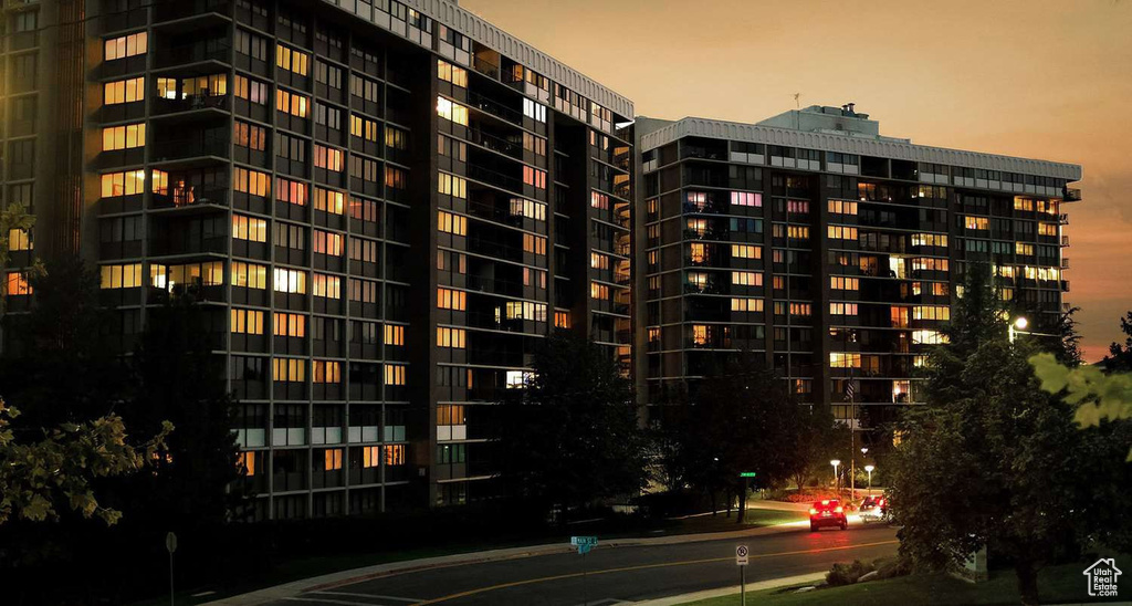 View of property at dusk