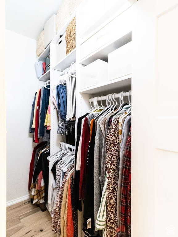 Spacious closet featuring wood finished floors