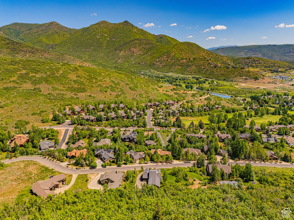 Aerial view of residential area featuring a mountainous background