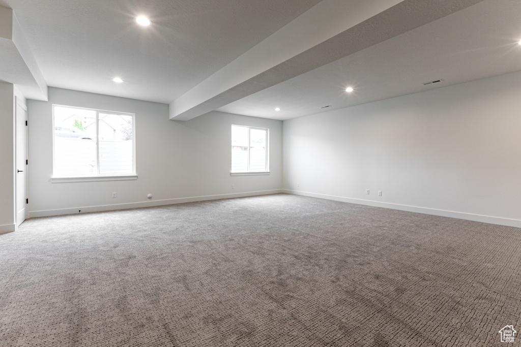 Empty room with carpet flooring, baseboards, and recessed lighting