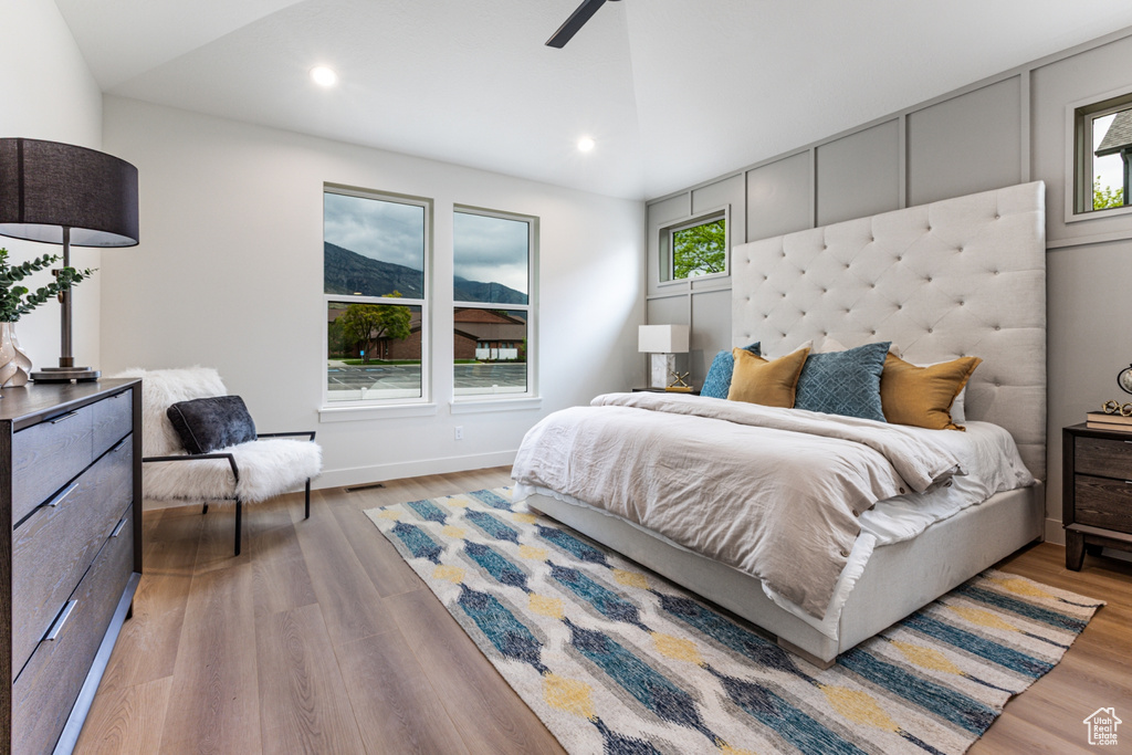 Bedroom with light wood-style flooring, a ceiling fan, visible vents, baseboards, and recessed lighting