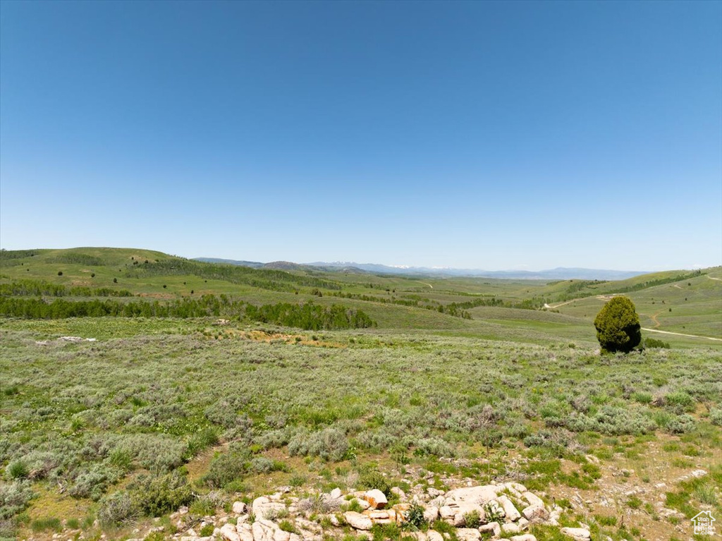 View of mountain background featuring rural landscape