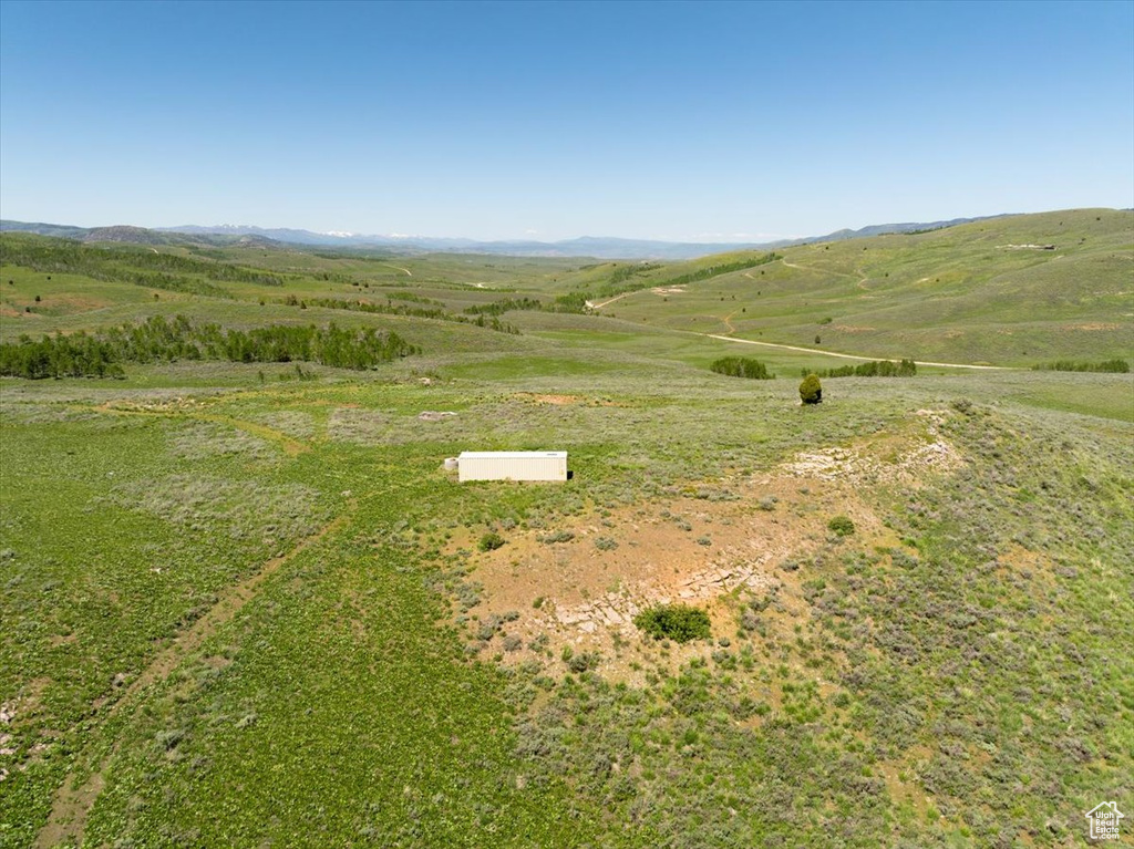 Aerial view of property\'s location with rural landscape and a mountain backdrop
