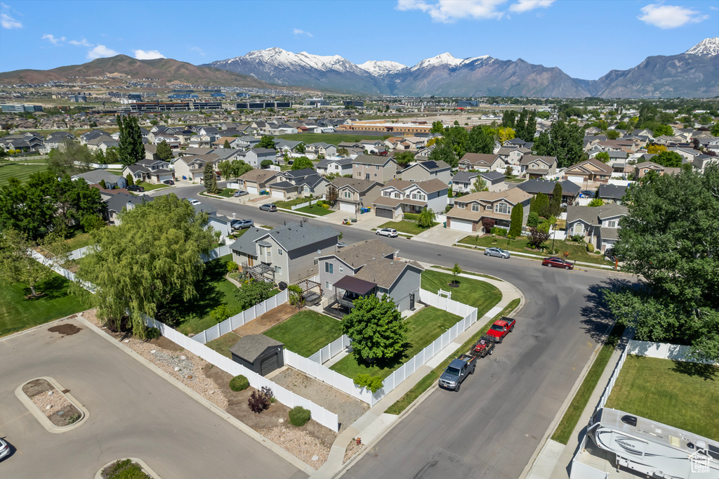 Aerial perspective of suburban area featuring a mountainous background