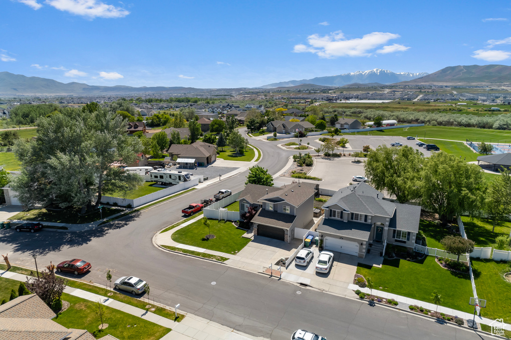 Aerial perspective of suburban area with a mountain backdrop