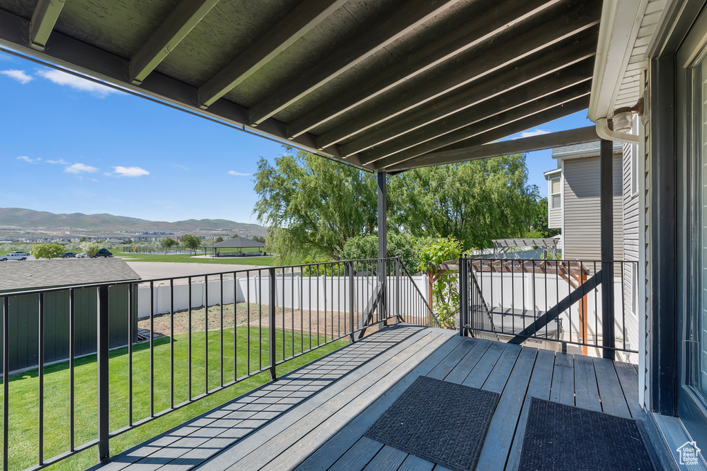Wooden terrace featuring a mountain view