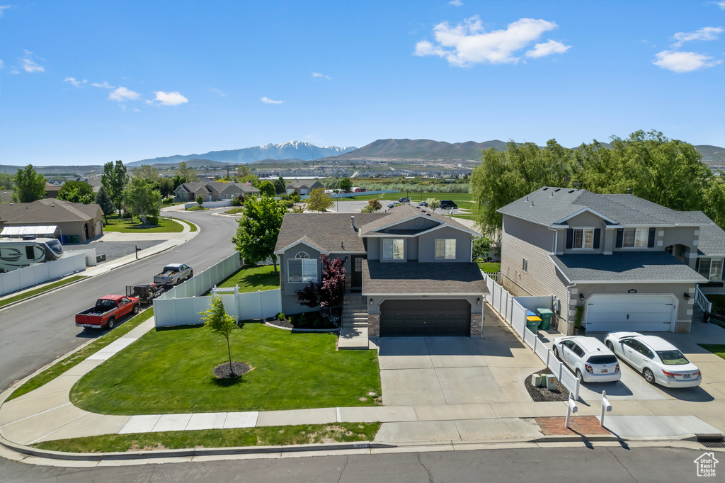 Aerial perspective of suburban area with a mountain backdrop