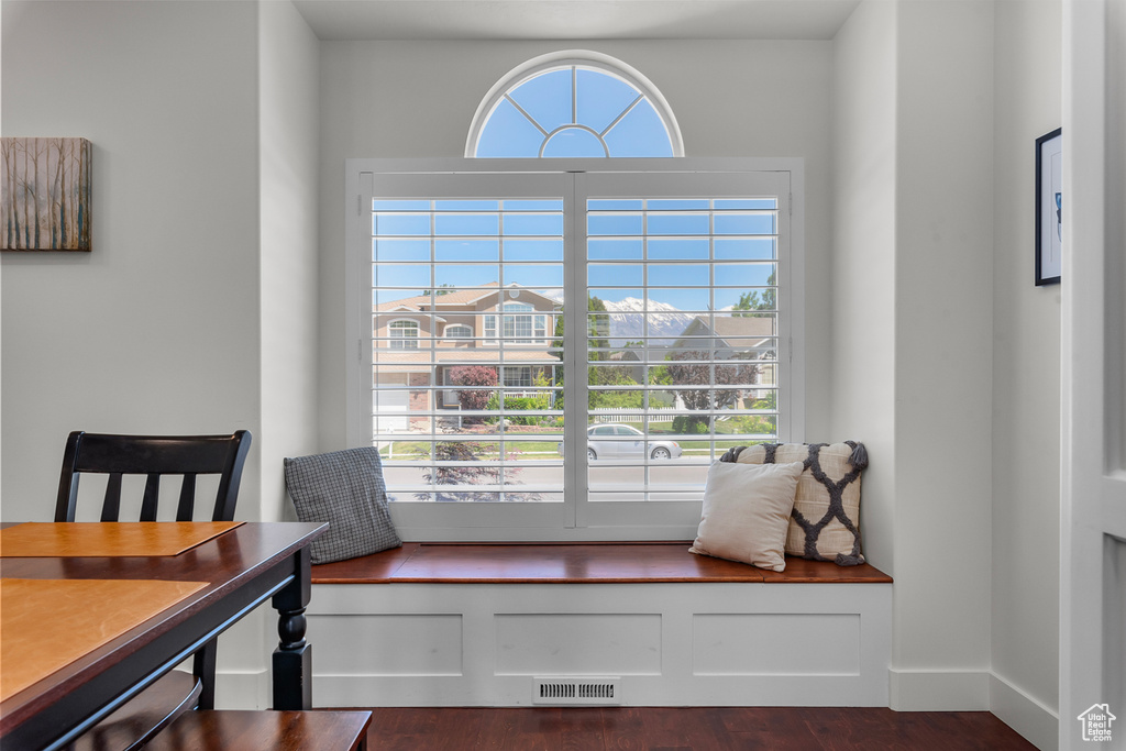 Living area featuring dark wood-type flooring