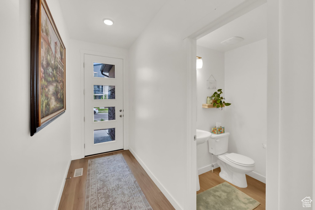 Entryway featuring wood finished floors and baseboards