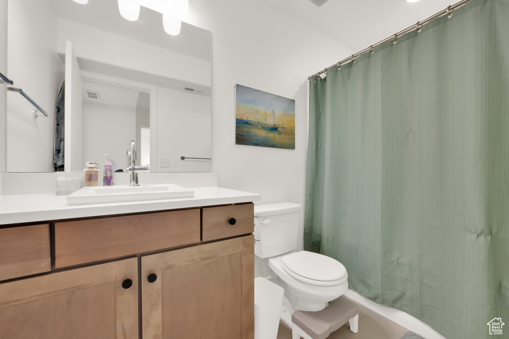 Full bath with vanity and toilet