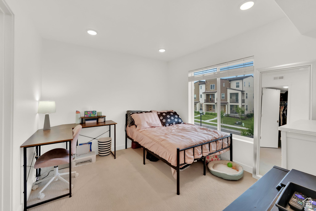 Bedroom featuring baseboards, carpet floors, and recessed lighting