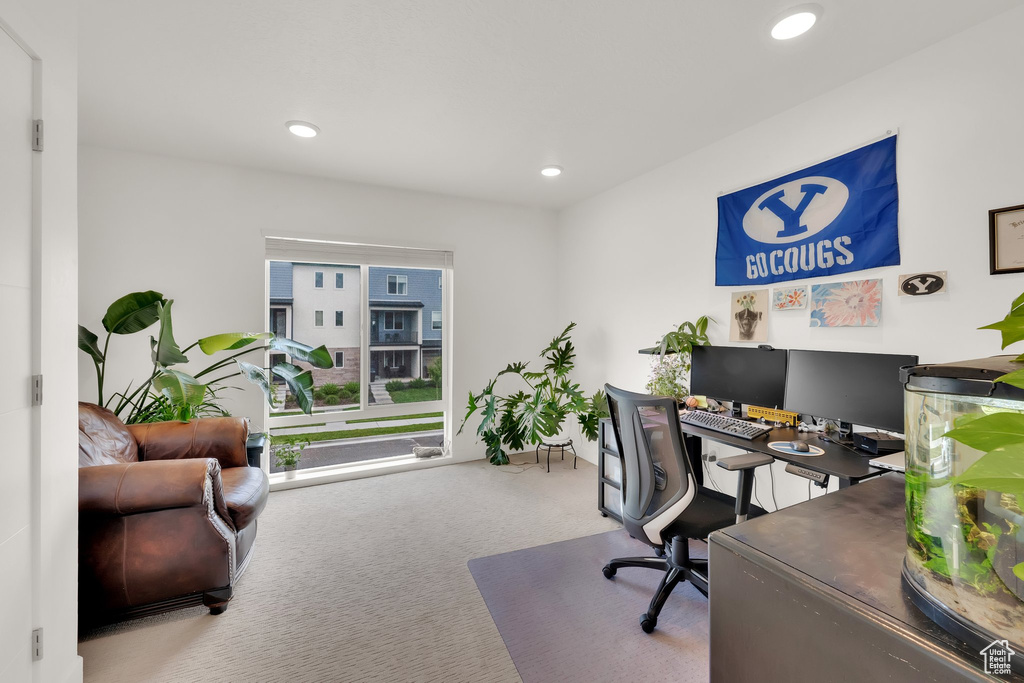 Carpeted home office featuring recessed lighting
