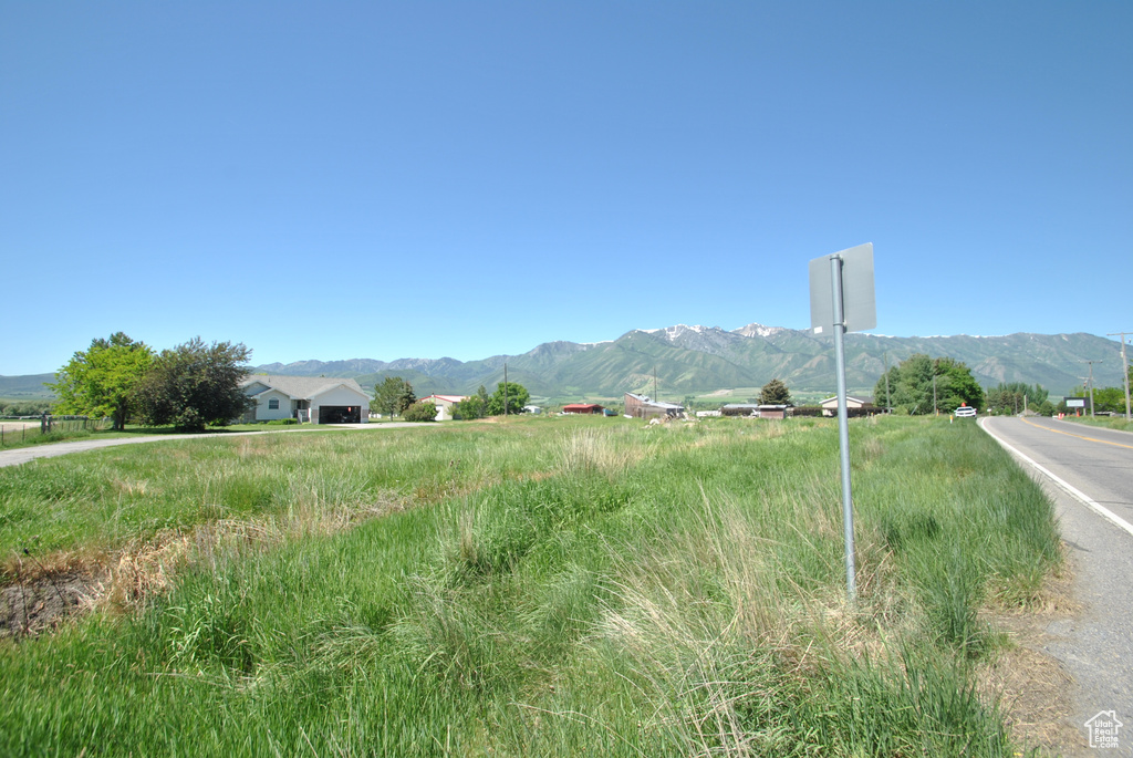View of mountain backdrop with rural landscape