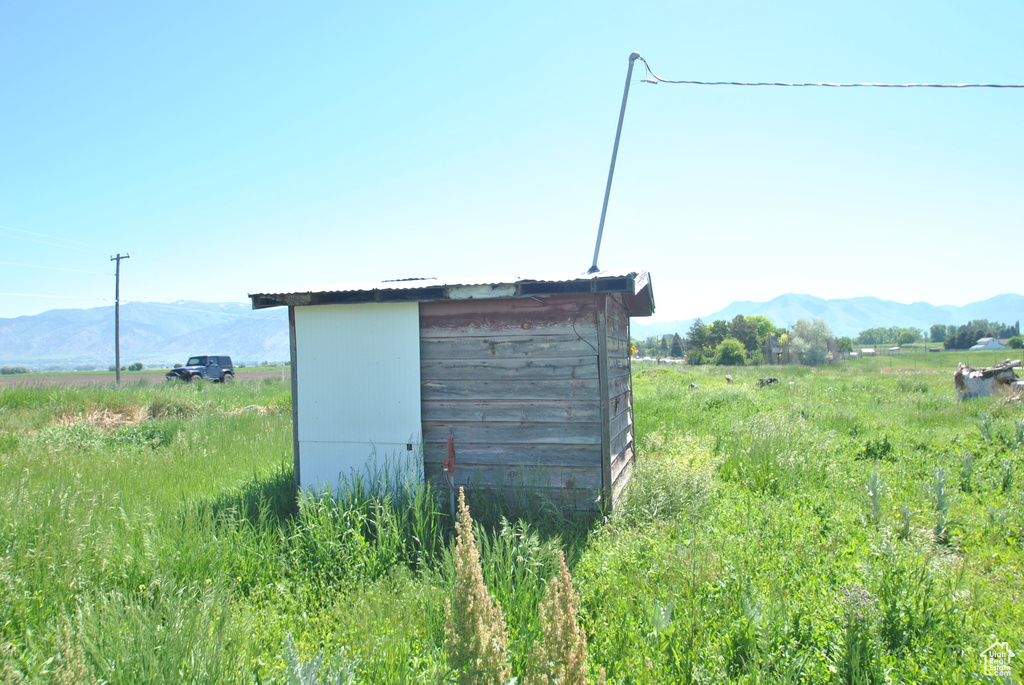 View of outbuilding with a mountain view and a view of countryside