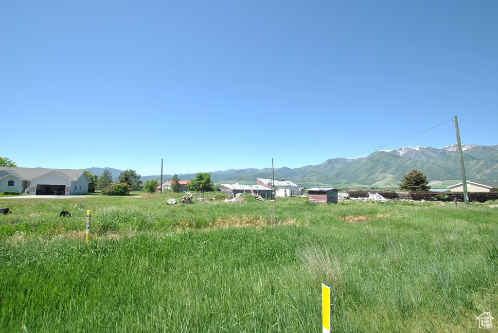 View of mountain backdrop featuring rural landscape