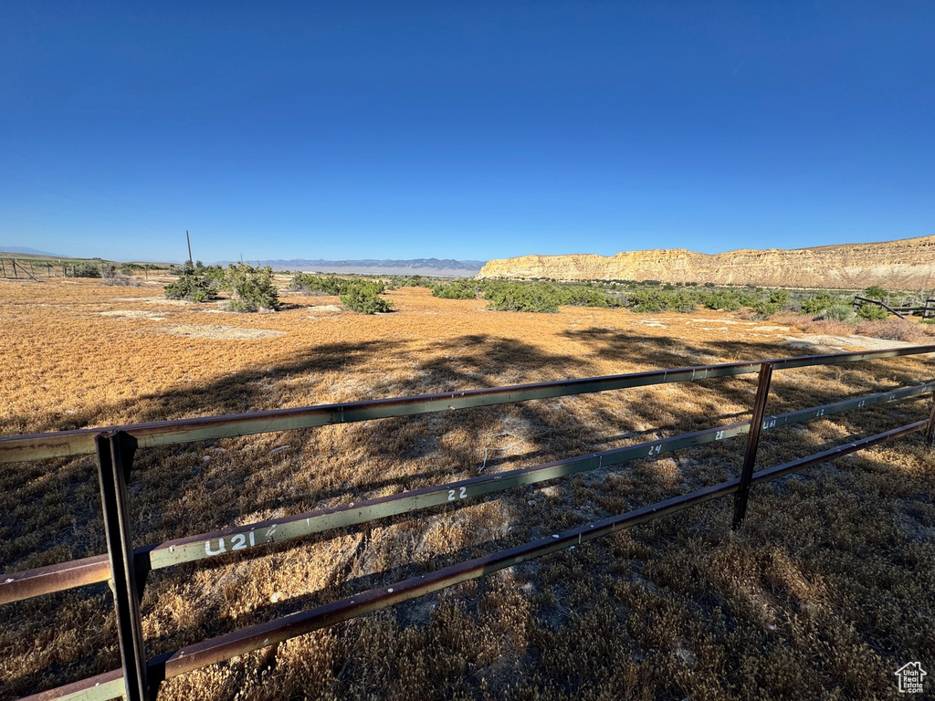 View of yard with a rural view