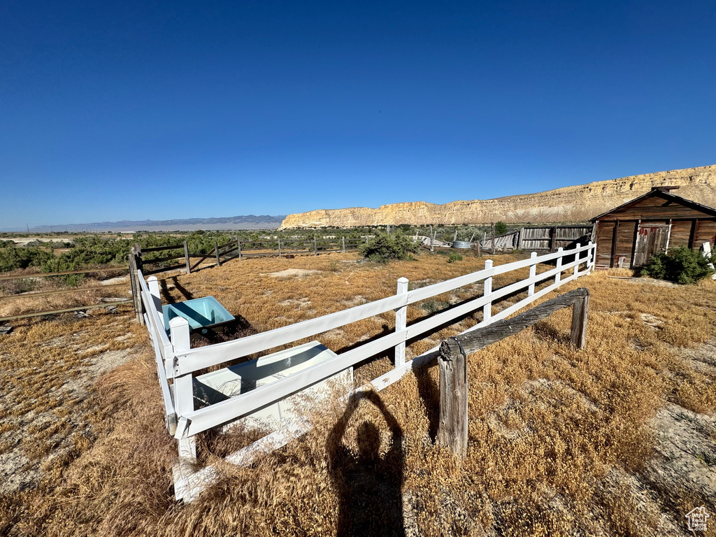 View of yard with a view of rural / pastoral area and a mountain view