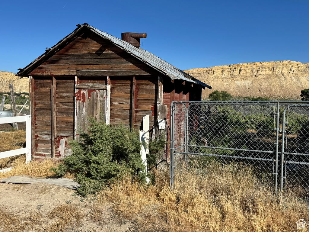 View of property exterior with an outbuilding