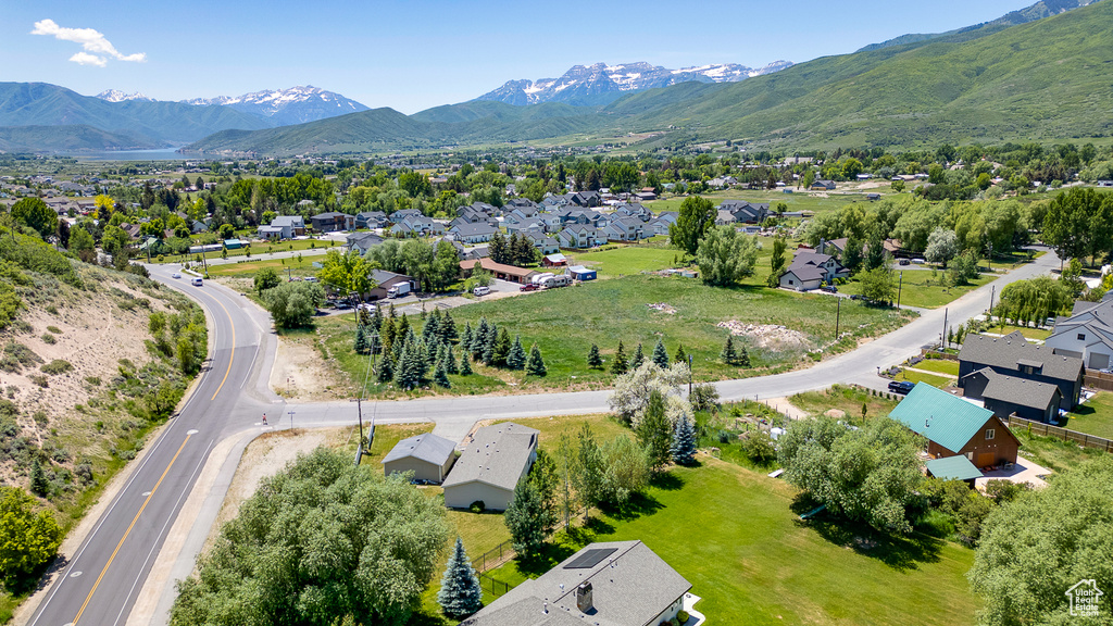 Aerial view of residential area featuring a mountain backdrop
