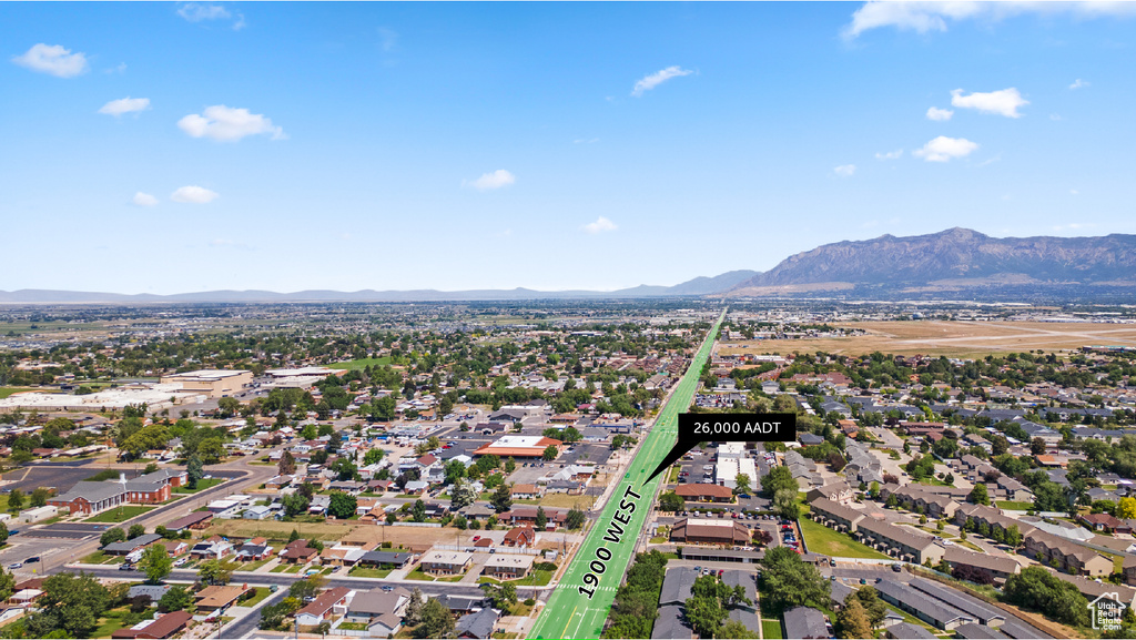 Aerial view of residential area featuring a mountainous background