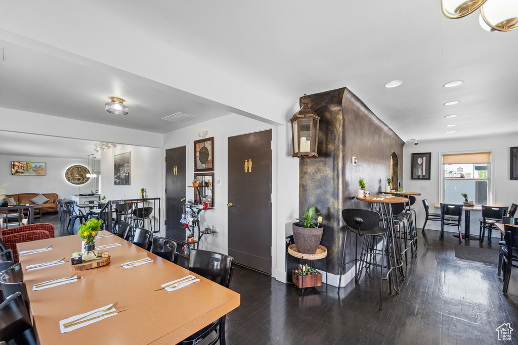Dining space featuring wood finished floors and recessed lighting