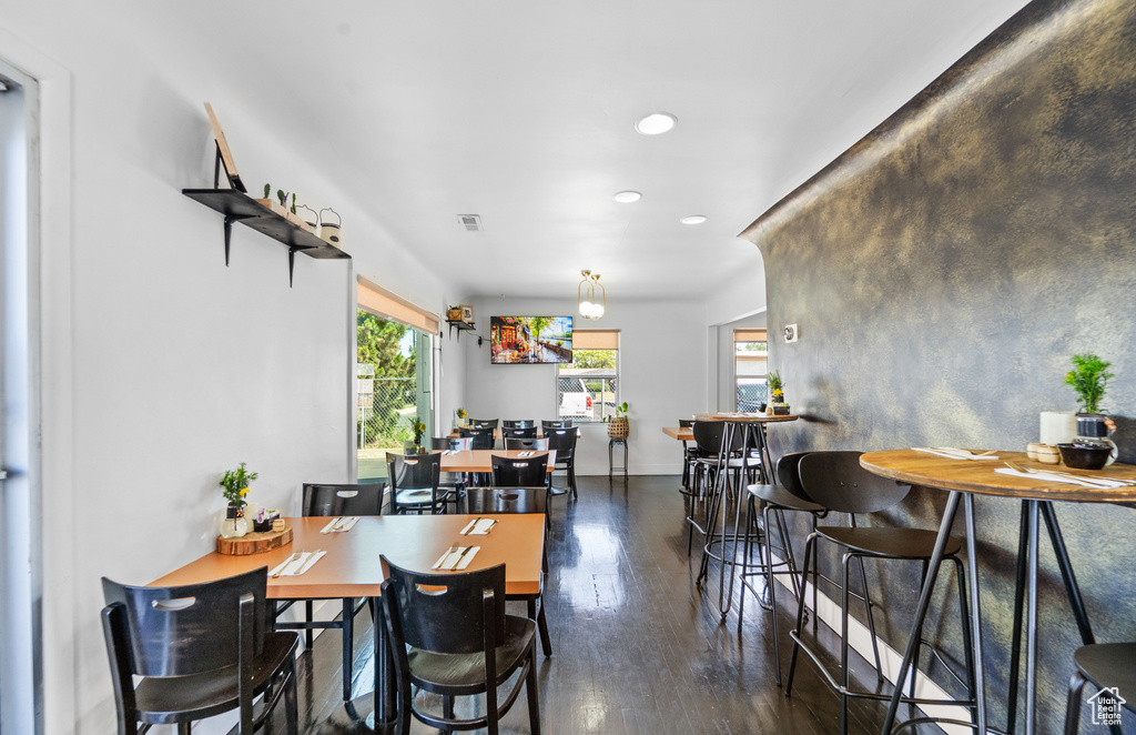 Dining space featuring recessed lighting, wood finished floors, and baseboards