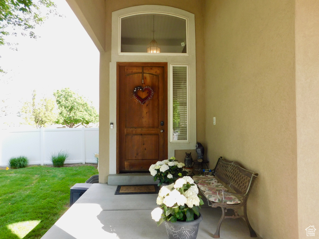 View of exterior entry featuring stucco siding