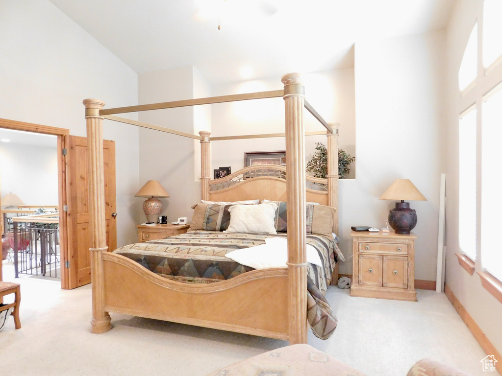 Bedroom with carpet floors, access to outside, and baseboards