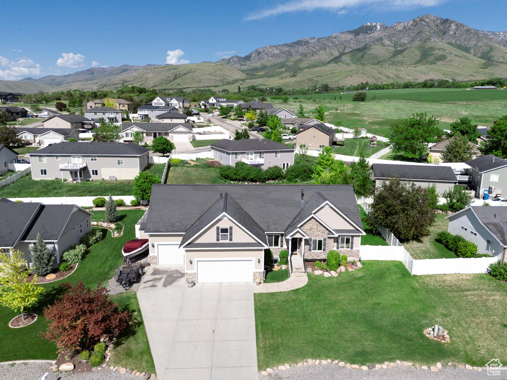 Aerial perspective of suburban area with a mountainous background