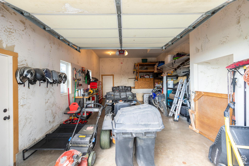 Garage featuring a garage door opener