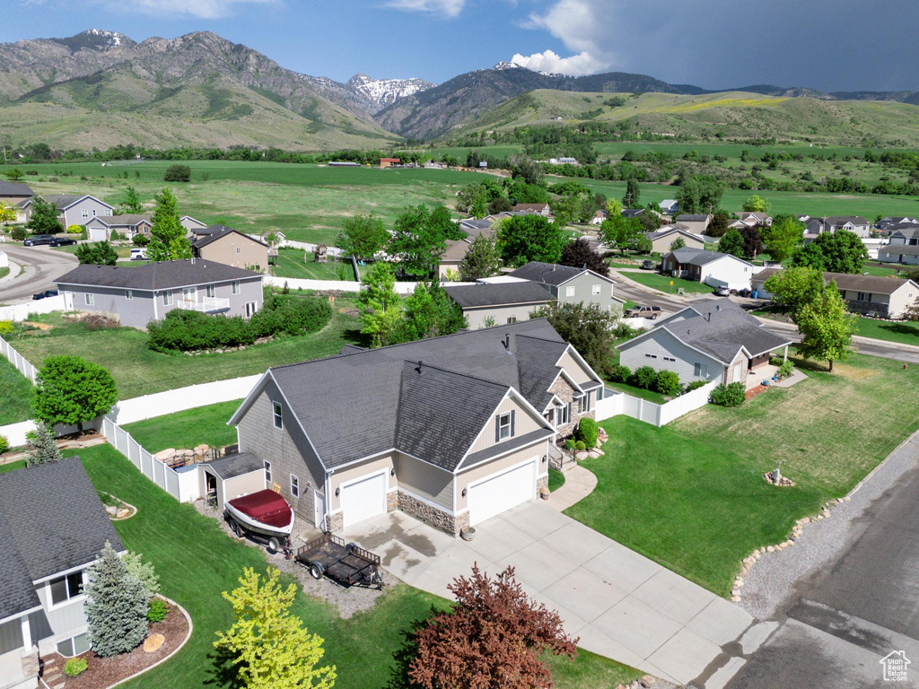 Aerial view of residential area featuring a mountainous background