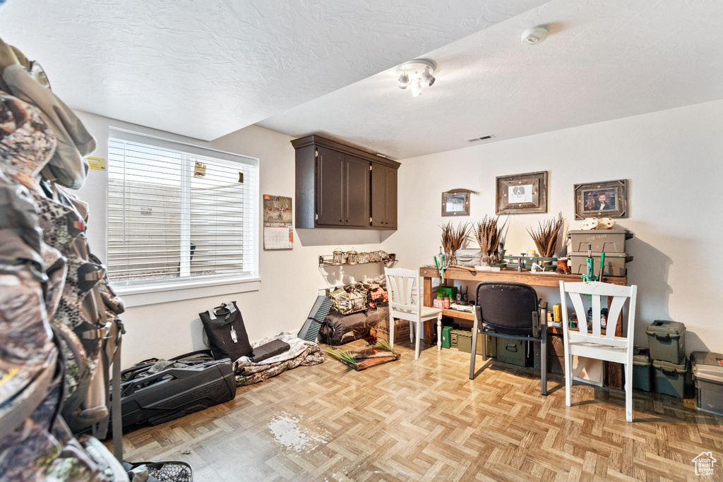 Home office featuring a textured ceiling