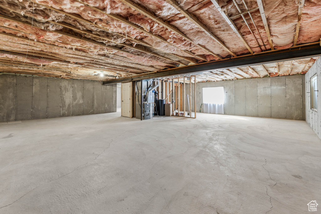Below grade area featuring heating unit