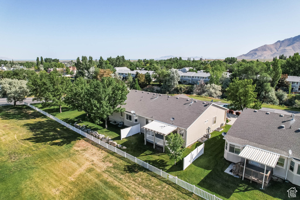 Aerial view of residential area featuring a mountainous background